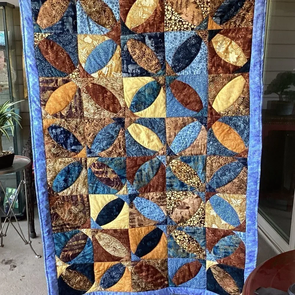 Patchwork Quilt with Blue and Brown Tones